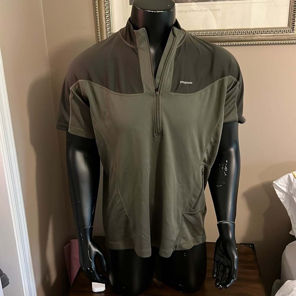 Patagonia cycling sports top with front zipper and left kidney pocket